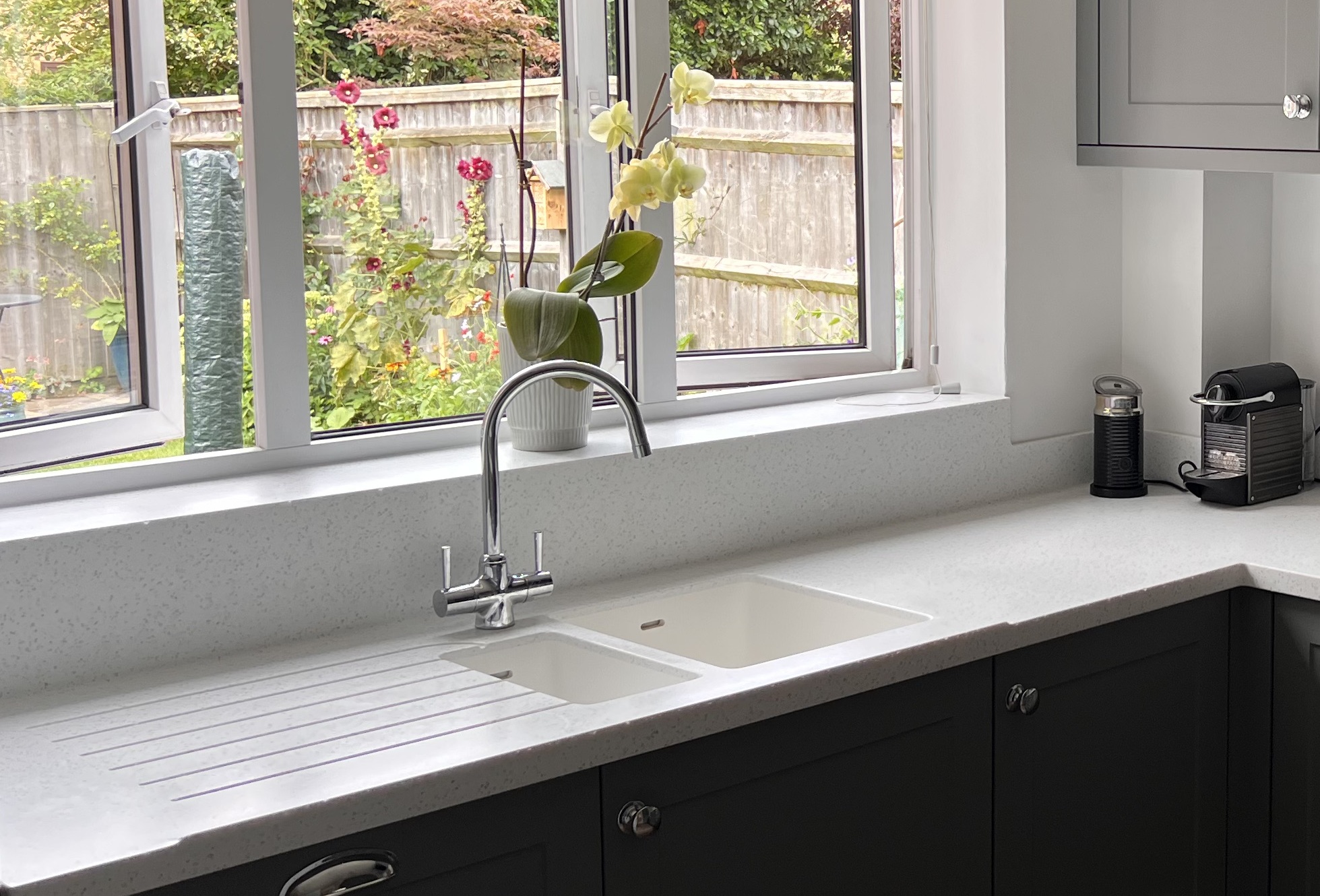 Seamless Overlay Calisto worktops with the full suite of seamless moulded  one and a half bowl sinks, non-drip lip and graded drainer grooves