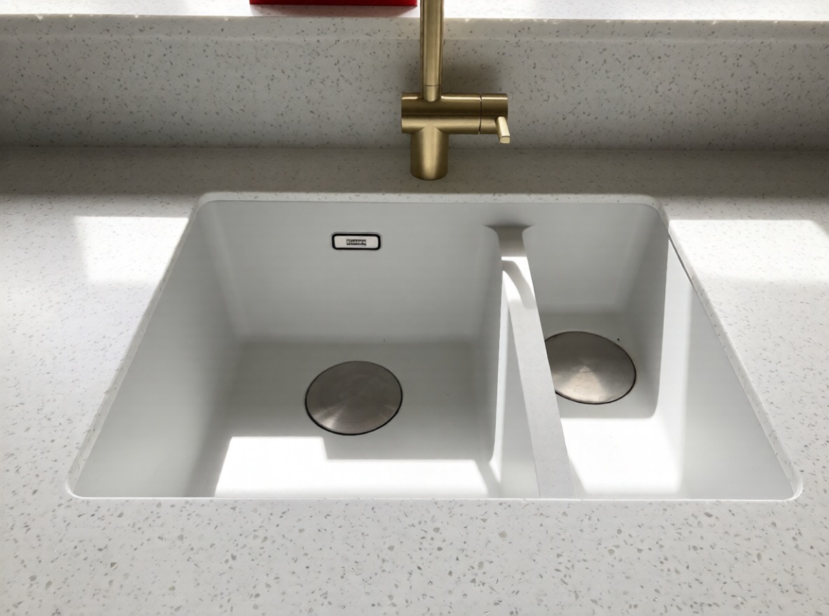 Seamless Overlay in our most popular Calisto colour complimenting the Franke undermount one and a half bowl sink