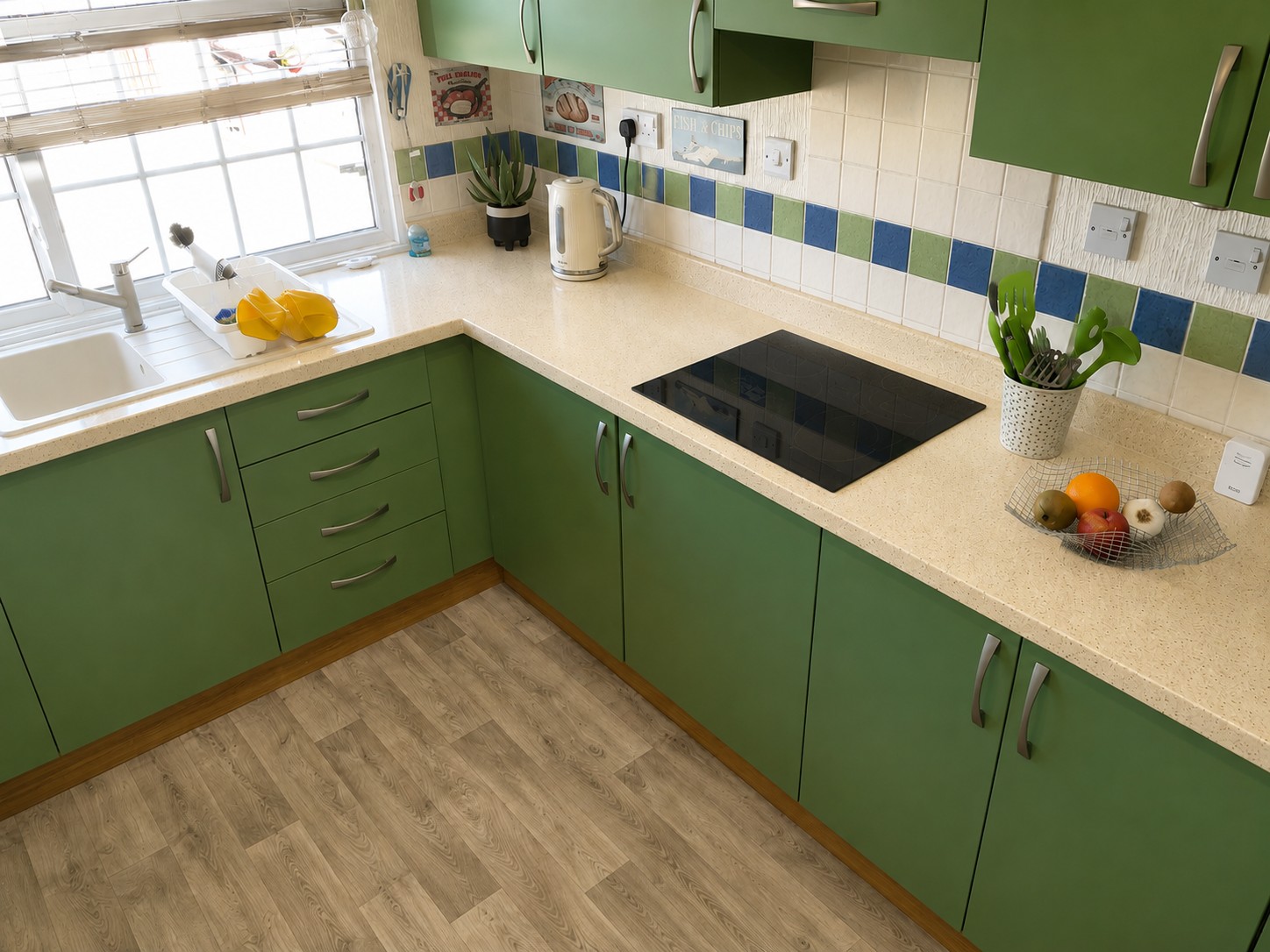 Seamless Overlay in Calcite with 150mm planted upstands and the clients existing composite inset sink with integral drainier