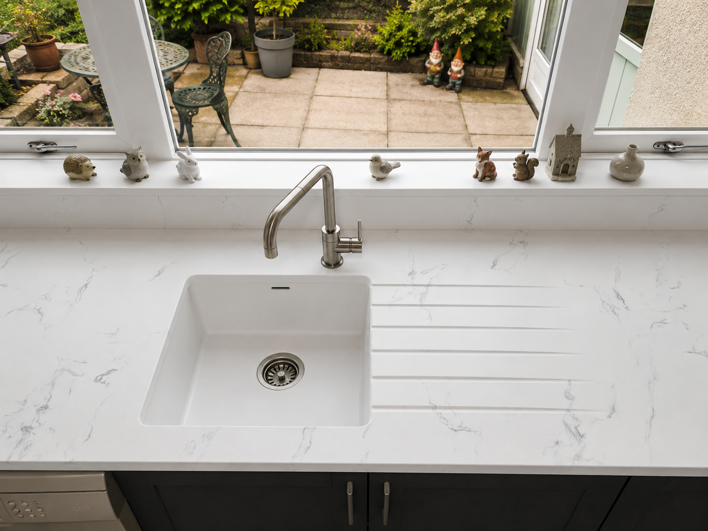 Seamless Overlay in Torini marble with single bowl seamless sink with integrated drainer grooves and upstands